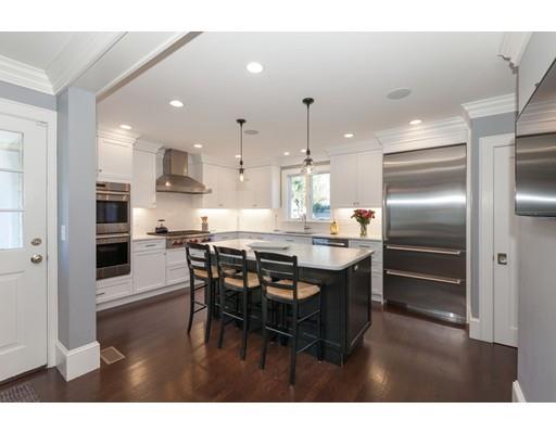 39 Rangeley Road Newton, MA 02465 - Photo 2 of 16 a kitchen with kitchen island a counter top space cabinets and stainless steel appliances