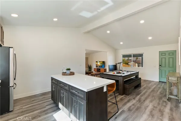 a kitchen with a sink stove and wooden cabinets
