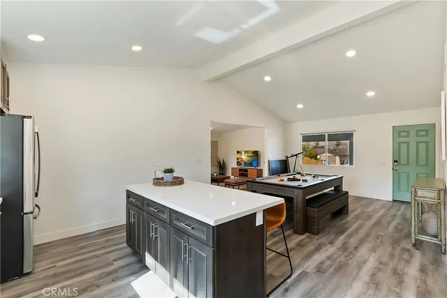a kitchen with a sink stove and wooden cabinets