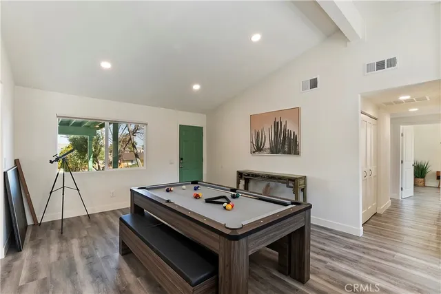 a living room with game table