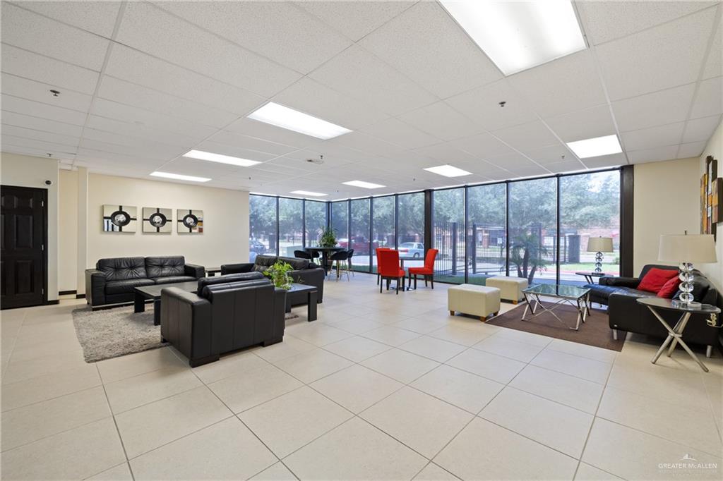813 Travis Street, Unit 203 Mission, TX 78572 - Photo 21 of 30 a large room with gym equipment and a large window