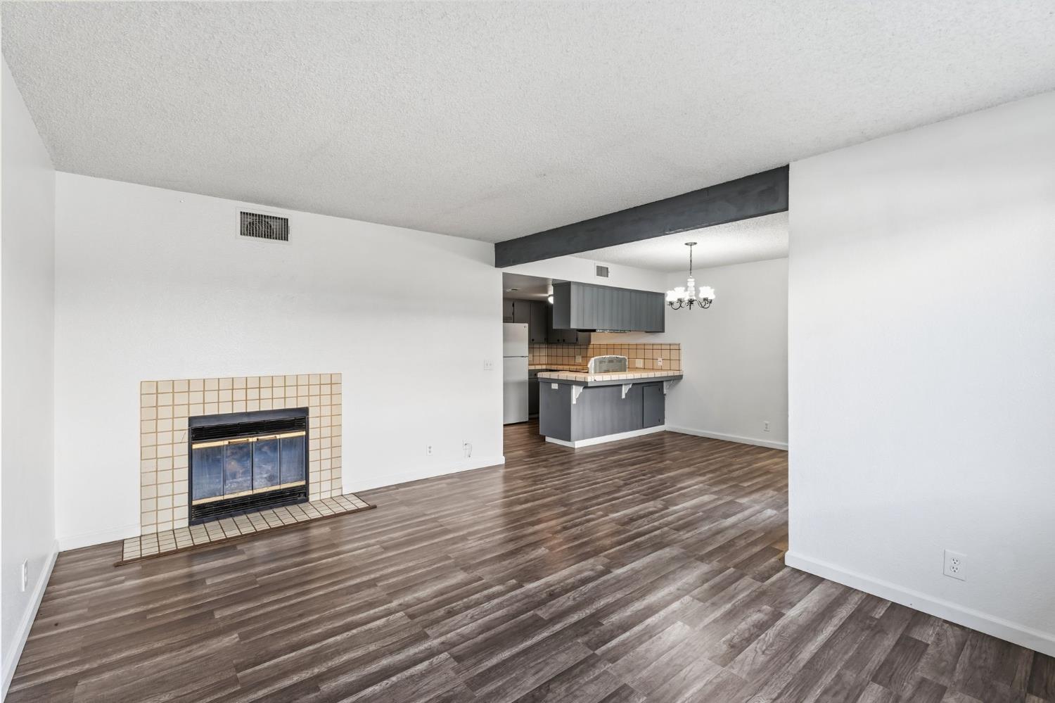 50 North 19th Avenue, Unit AF Lemoore, CA 93245 - Photo 11 of 40 a view of kitchen and wooden floor