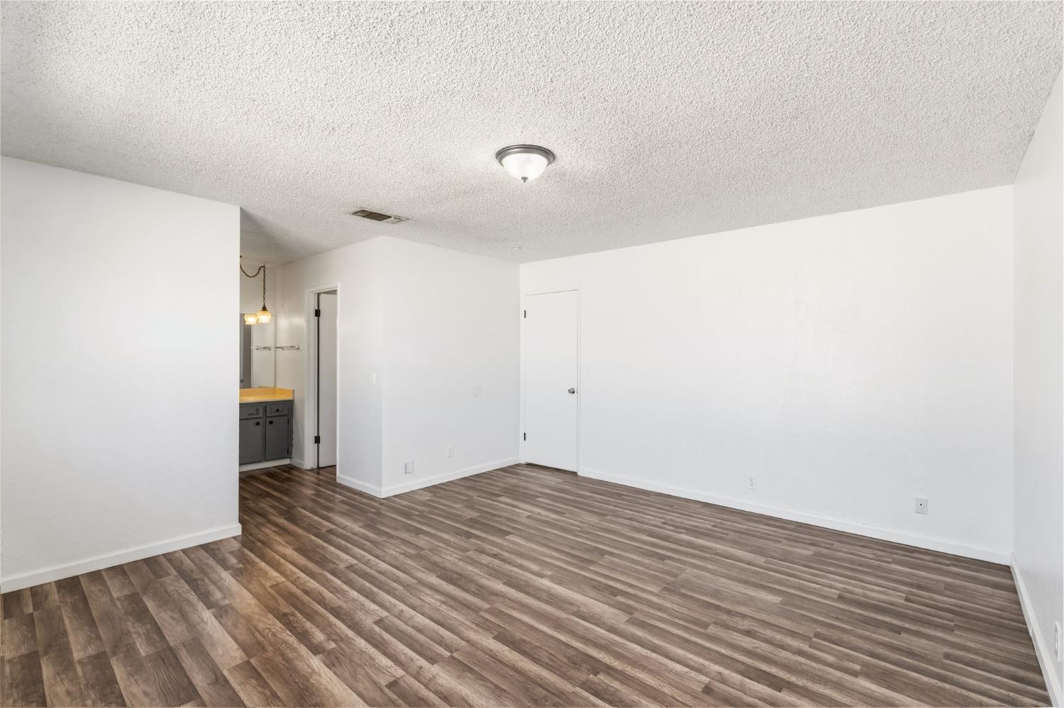 50 North 19th Avenue, Unit AF Lemoore, CA 93245 - Photo 17 of 40 a view of an empty room with wooden floor