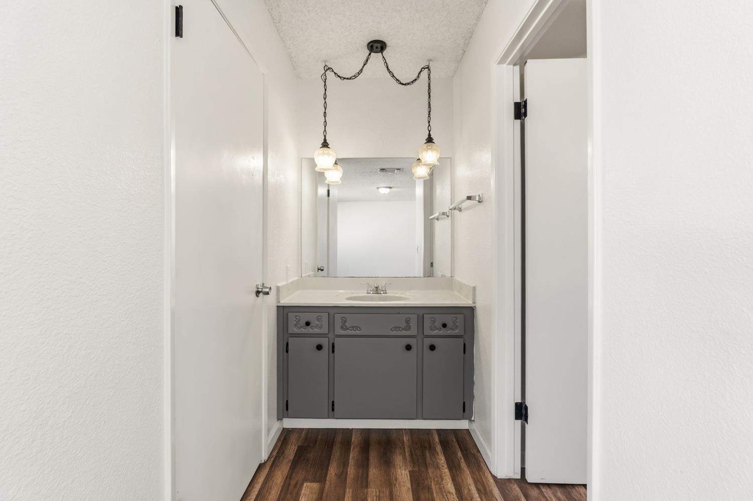 50 North 19th Avenue, Unit AF Lemoore, CA 93245 - Photo 18 of 40 a bathroom with a sink and a mirror
