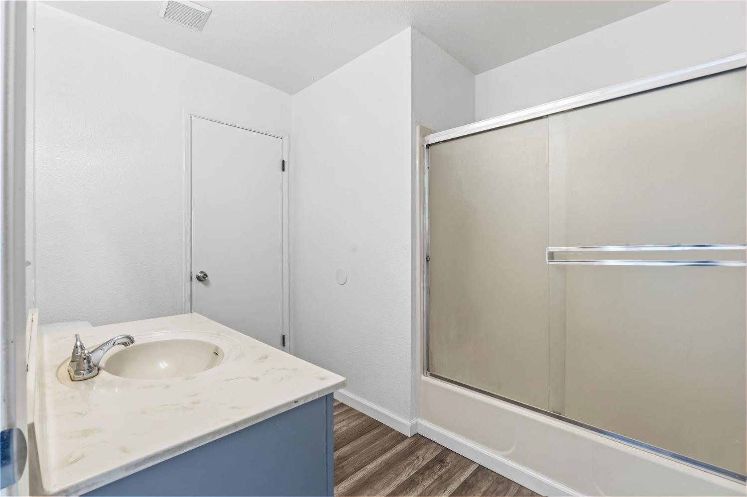 50 North 19th Avenue, Unit AF Lemoore, CA 93245 - Photo 20 of 40 a bathroom with a sink and shower