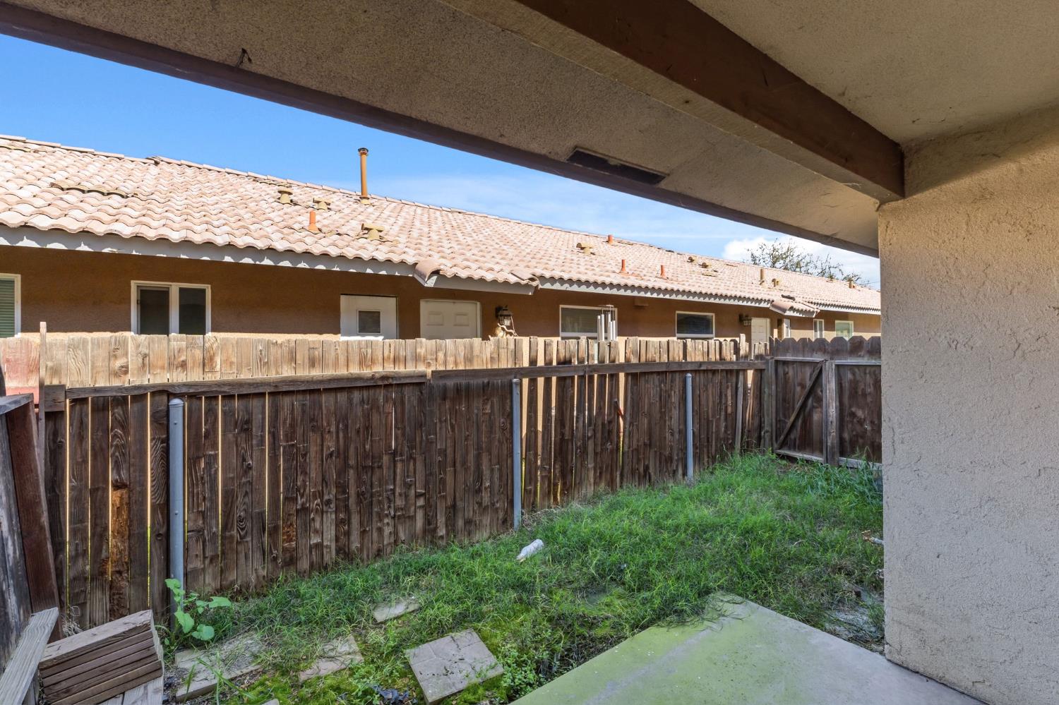 50 North 19th Avenue, Unit AF Lemoore, CA 93245 - Photo 24 of 40 a view of a house with wooden fence