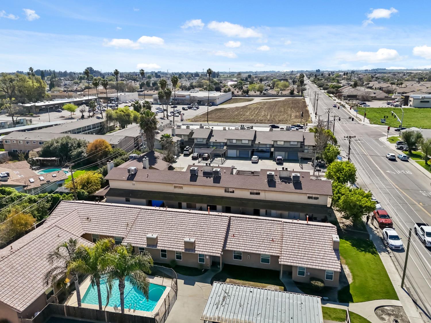 50 North 19th Avenue, Unit AF Lemoore, CA 93245 - Photo 37 of 40 a view of a city with lawn chairs plants and large tree