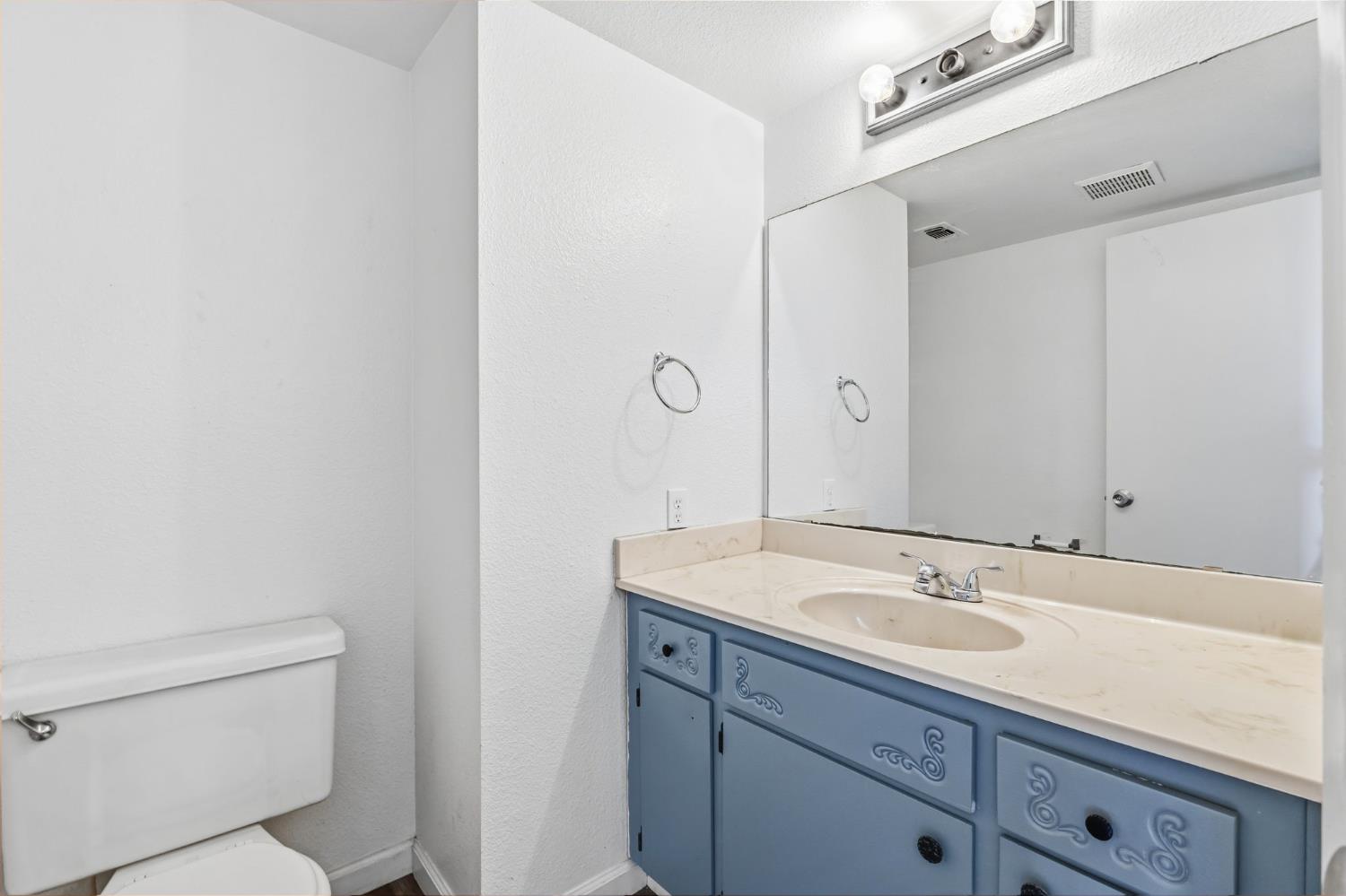 50 North 19th Avenue, Unit AF Lemoore, CA 93245 - Photo 6 of 40 a bathroom with a sink toilet and shower