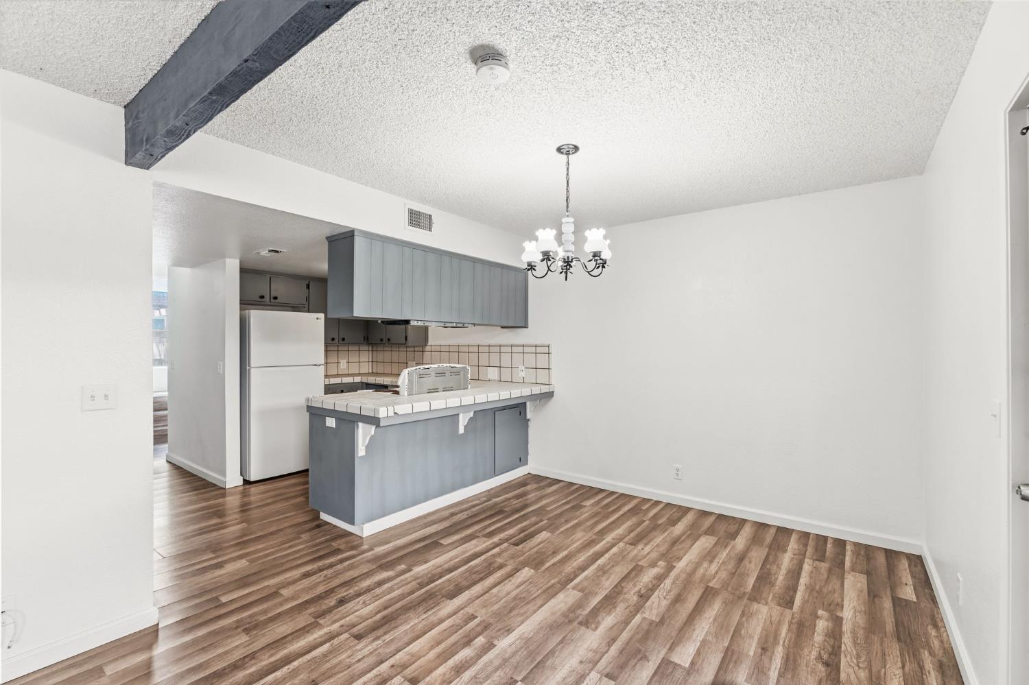 50 North 19th Avenue, Unit AF Lemoore, CA 93245 - Photo 8 of 40 a open kitchen with a sink dishwasher a refrigerator and a stove