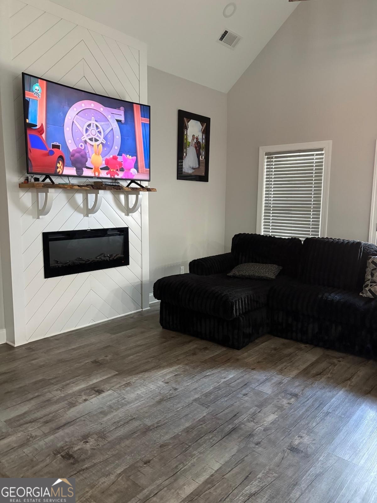 606 Old River Road Cornelia, GA 30531 - Photo 12 of 27 a living room with furniture and a fireplace