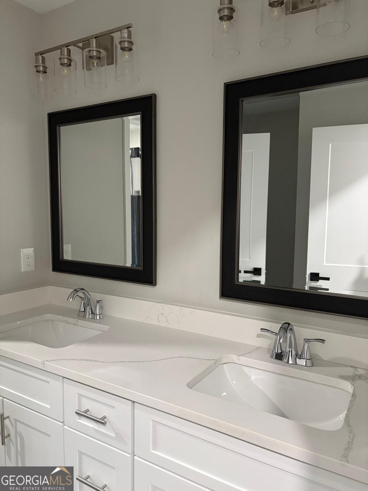 606 Old River Road Cornelia, GA 30531 - Photo 24 of 27 a bathroom with mirror a sink and vanity