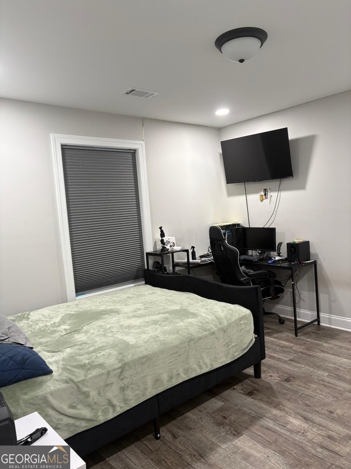 606 Old River Road Cornelia, GA 30531 - Photo 8 of 27 a bedroom with a bed and a flat screen tv