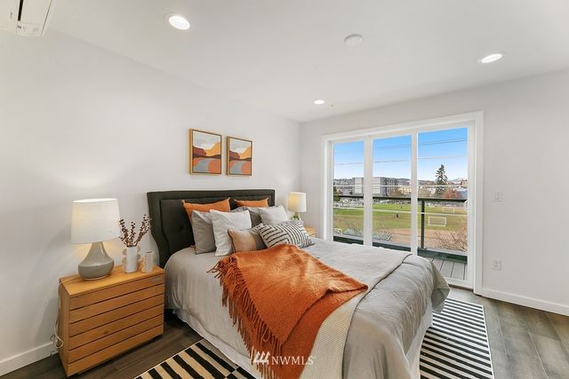 a bed room with a bed and a painting