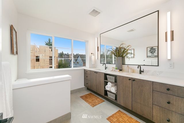 a view of bathroom with dual sinks