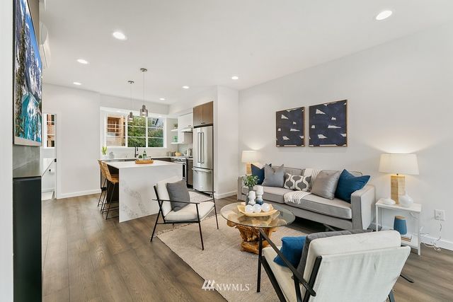 a living room with furniture and a table