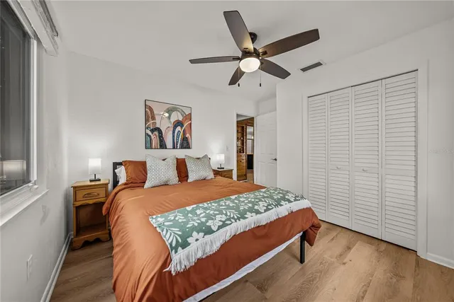 a dining room with furniture and a floor to ceiling window