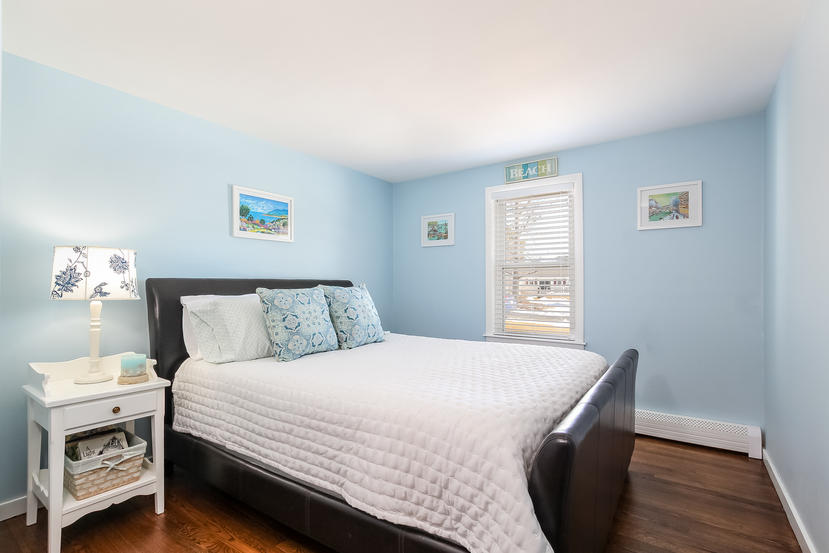 37 Maureen Road Centerville, MA 02632 - Photo 8 of 18 a bedroom with a bed and a night stand