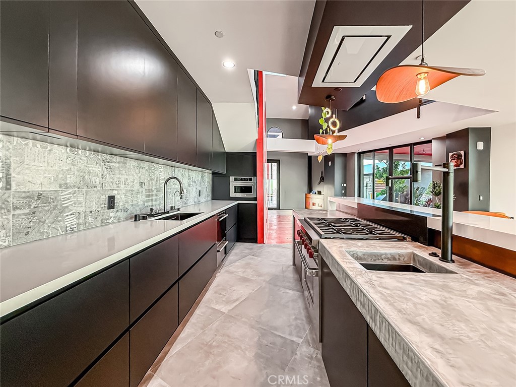 2514 Cayman Road Malibu, CA 90265 - Photo 29 of 73 a large kitchen with stainless steel appliances granite countertop a large stove and a sink