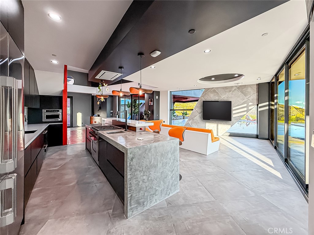 2514 Cayman Road Malibu, CA 90265 - Photo 30 of 73 a large kitchen with stainless steel appliances kitchen island granite countertop a large counter top and a stove