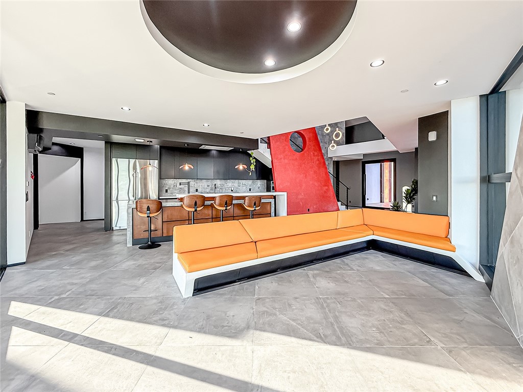 2514 Cayman Road Malibu, CA 90265 - Photo 31 of 73 a living room with kitchen island granite countertop furniture and a fireplace