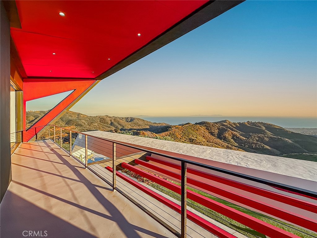 2514 Cayman Road Malibu, CA 90265 - Photo 41 of 73 a view of a balcony with furniture and city view