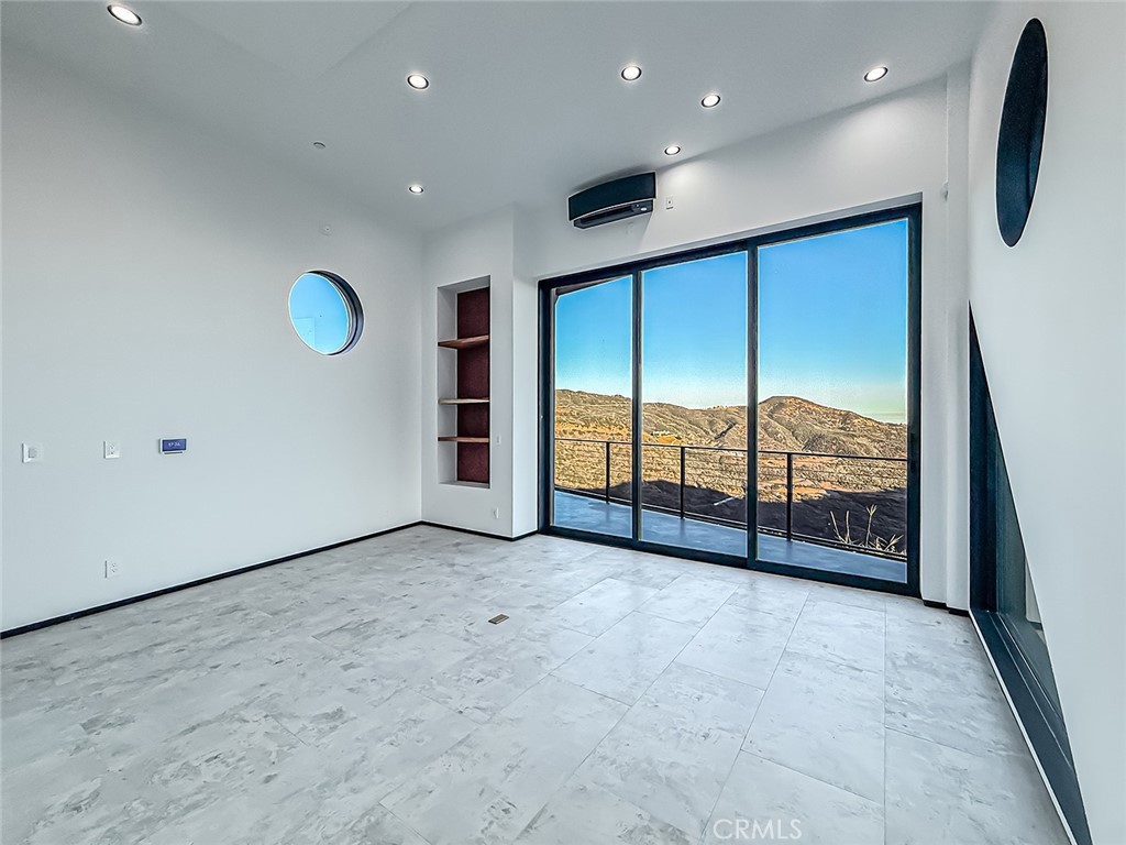 2514 Cayman Road Malibu, CA 90265 - Photo 48 of 73 a view of an empty room with a sliding door