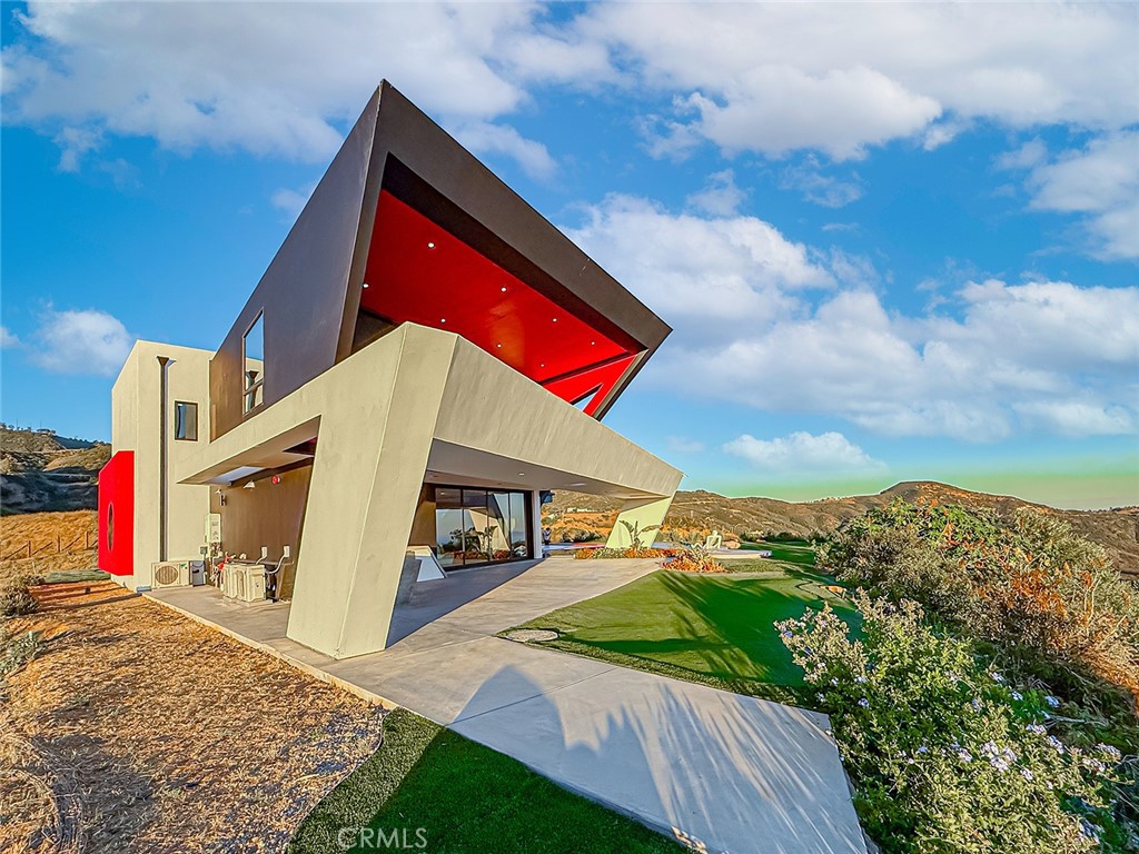 2514 Cayman Road Malibu, CA 90265 - Photo 68 of 73 a view of an and white house with a yard