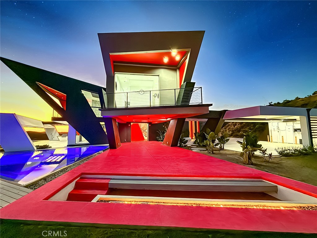 2514 Cayman Road Malibu, CA 90265 - Photo 8 of 73 a view of swimming pool with red chairs
