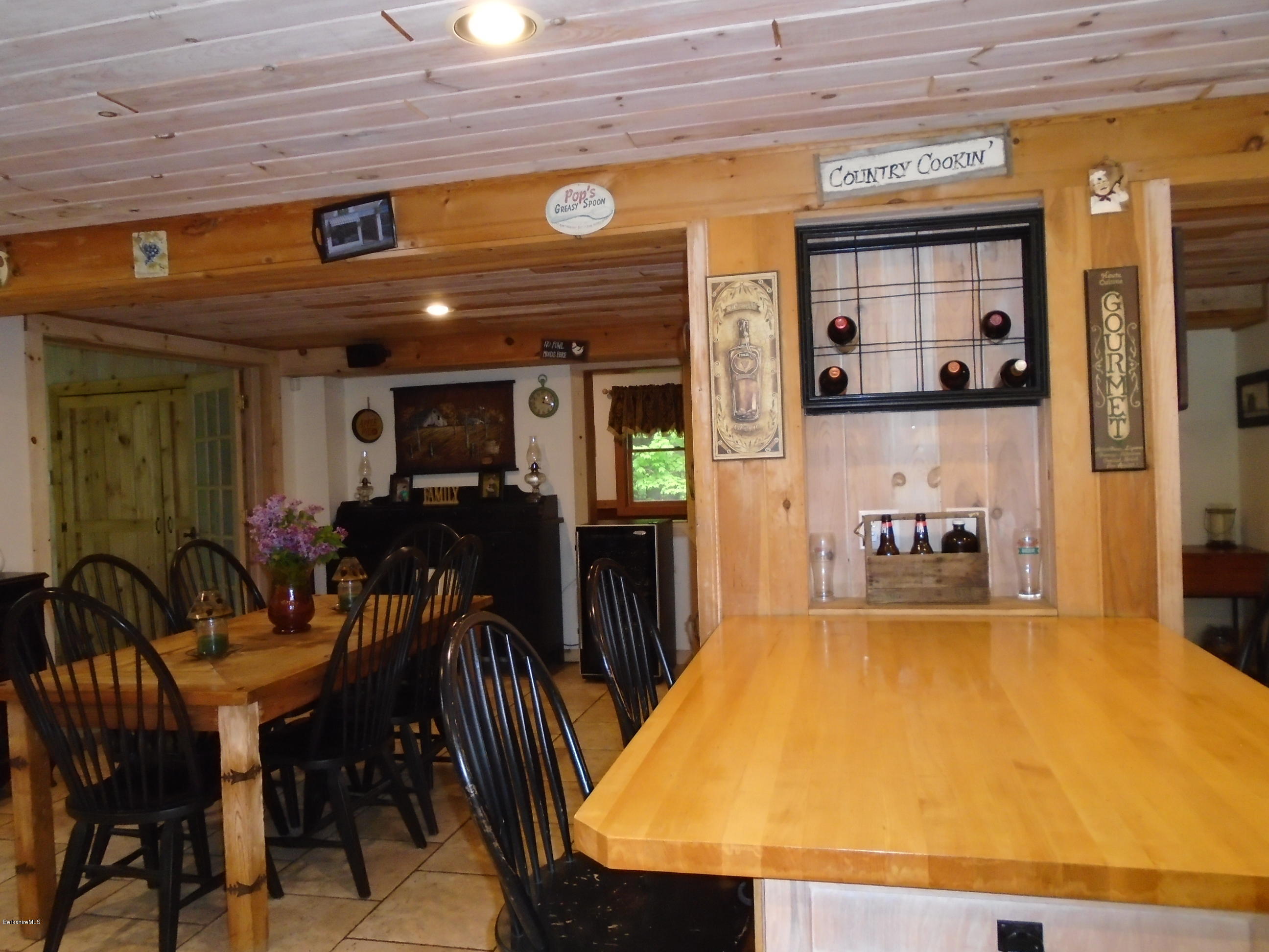 1350 South Main Road Otis, MA 01253 - Photo 13 of 56 a view of a dining room with furniture