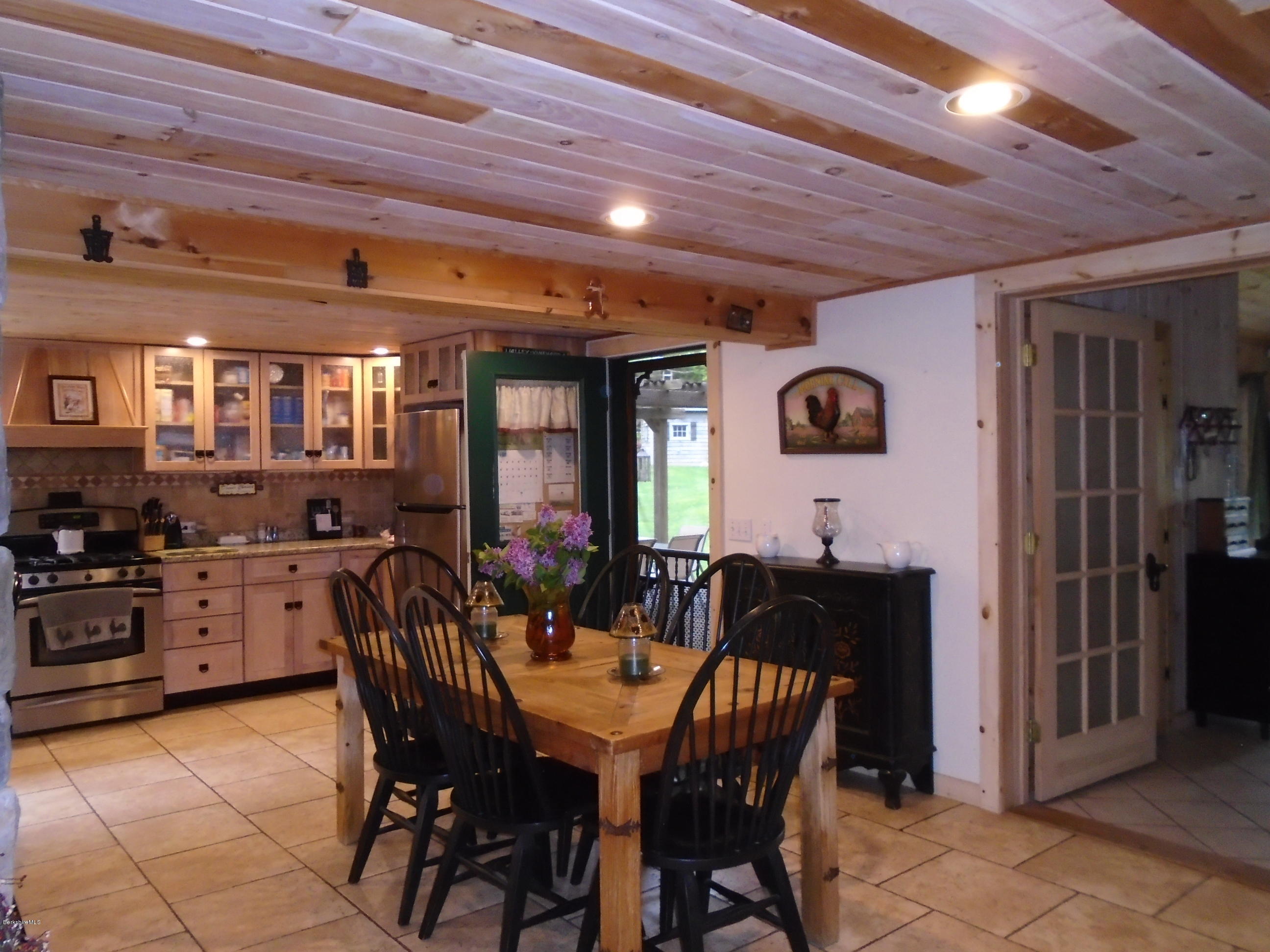 1350 South Main Road Otis, MA 01253 - Photo 16 of 56 a view of a dining room with furniture