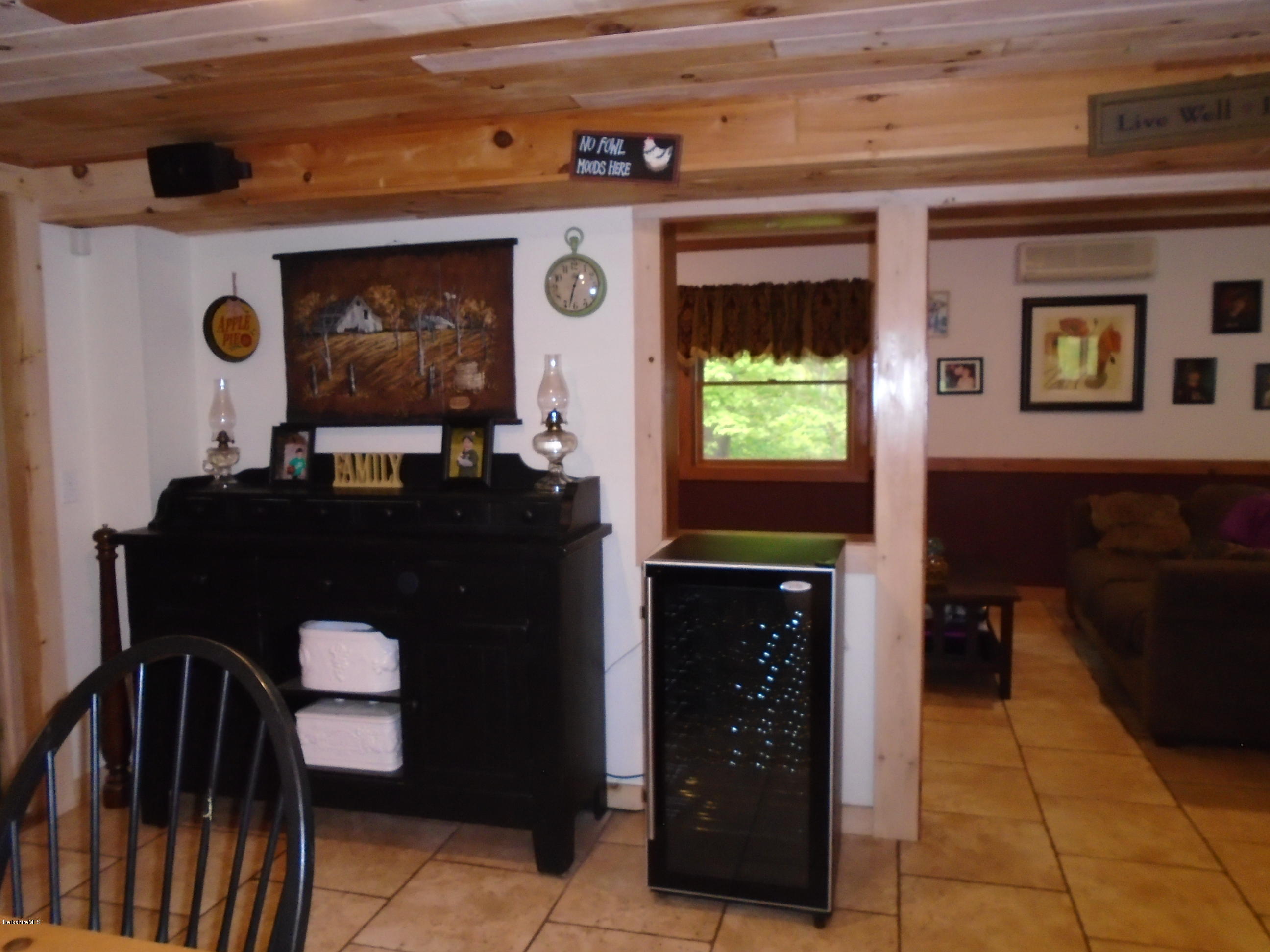 1350 South Main Road Otis, MA 01253 - Photo 20 of 56 a dining room with a table and chairs