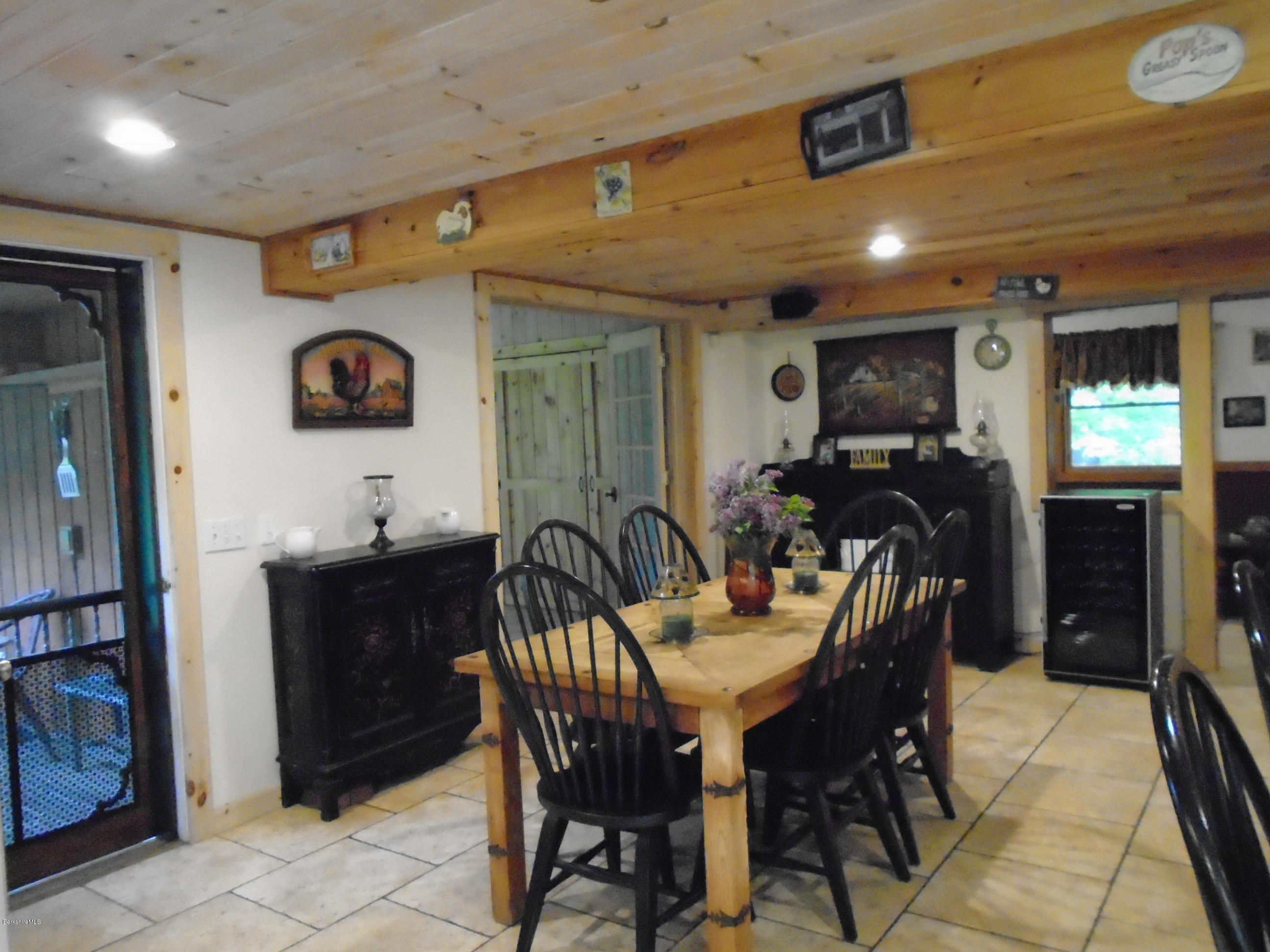 1350 South Main Road Otis, MA 01253 - Photo 23 of 56 a view of a dining room with furniture