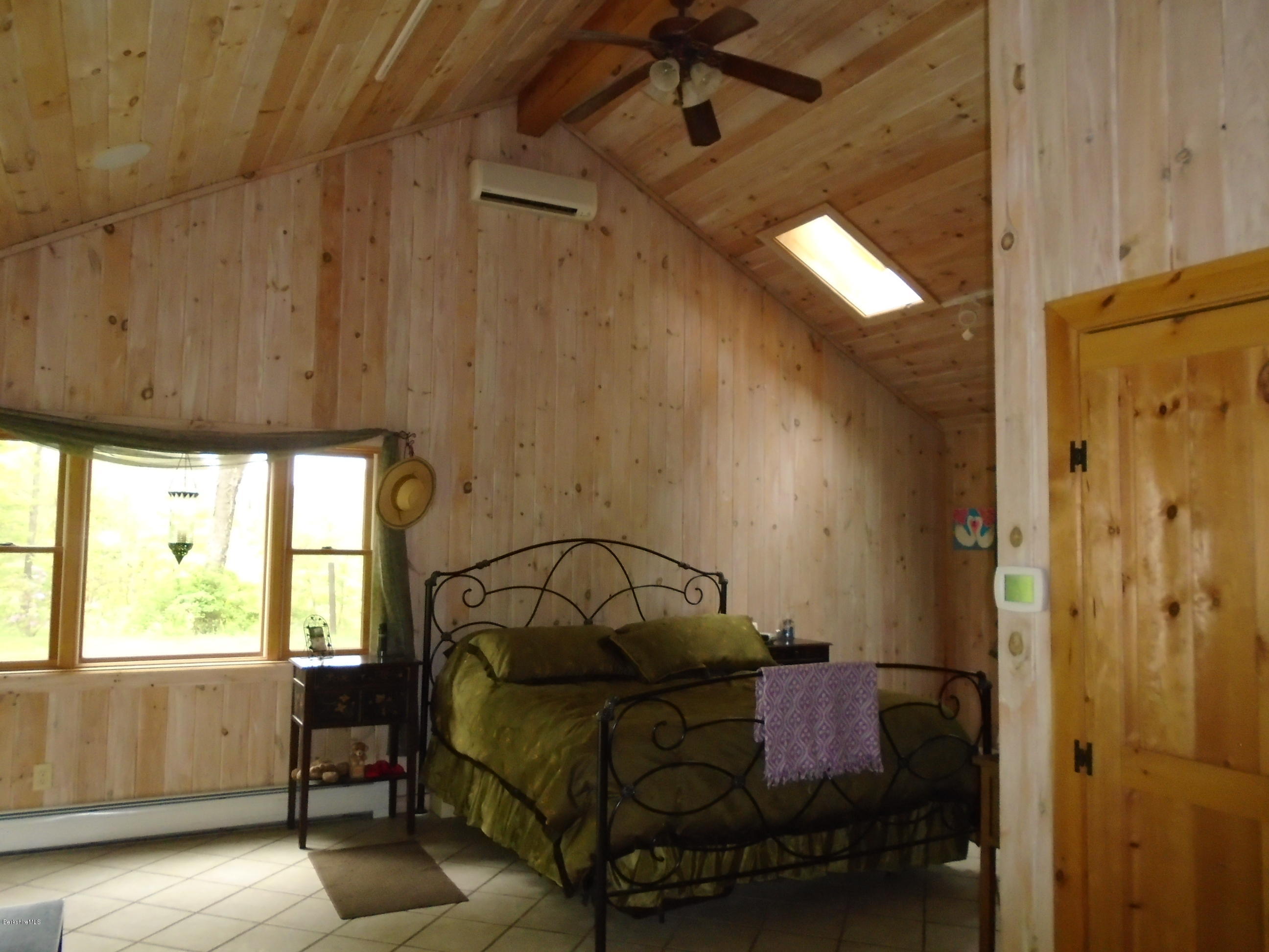 1350 South Main Road Otis, MA 01253 - Photo 33 of 56 a bedroom with a bed and a window