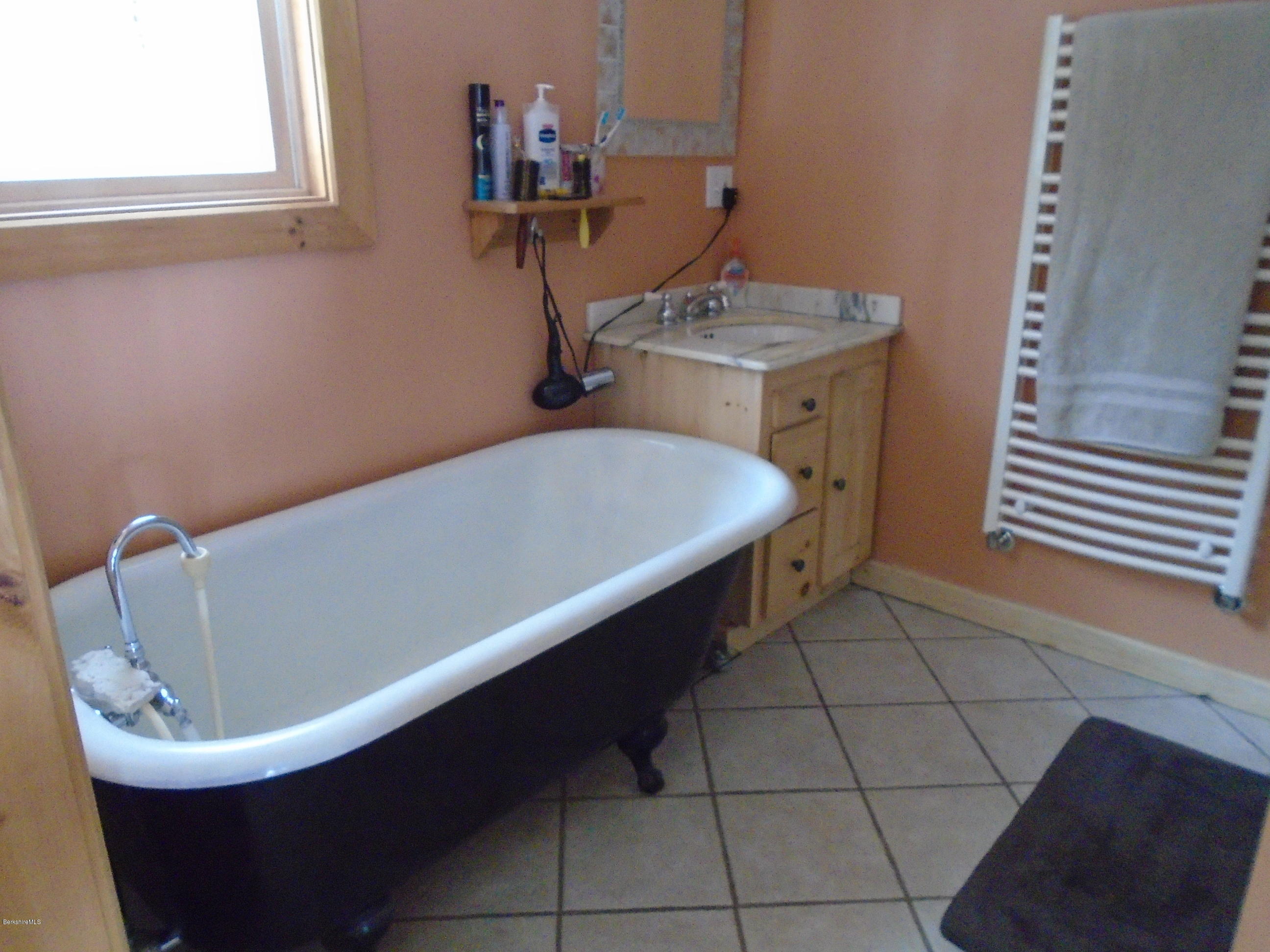 1350 South Main Road Otis, MA 01253 - Photo 36 of 56 a bathroom with a sink and a mirror