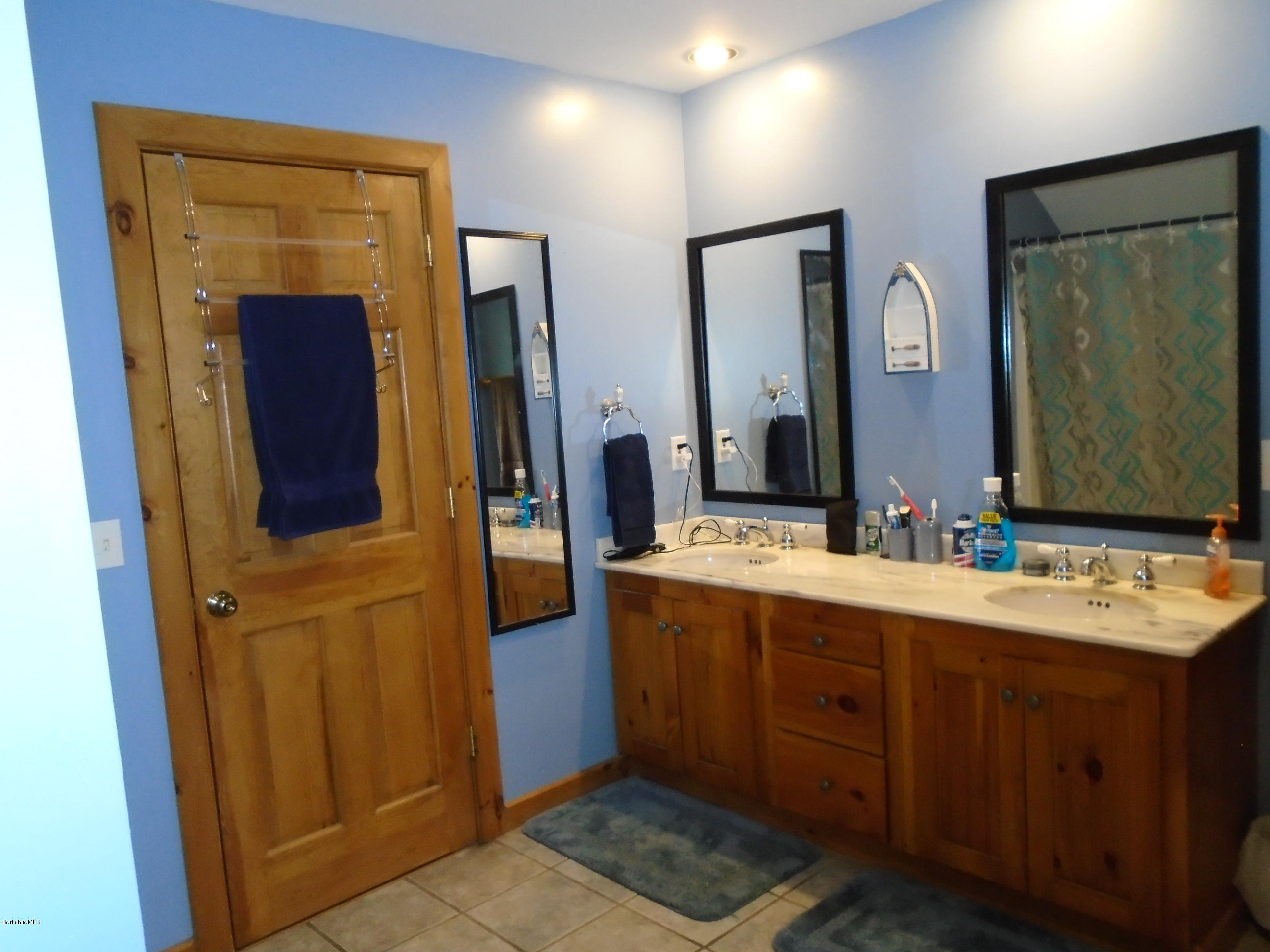 1350 South Main Road Otis, MA 01253 - Photo 46 of 56 a bathroom with a double vanity sink mirror and double