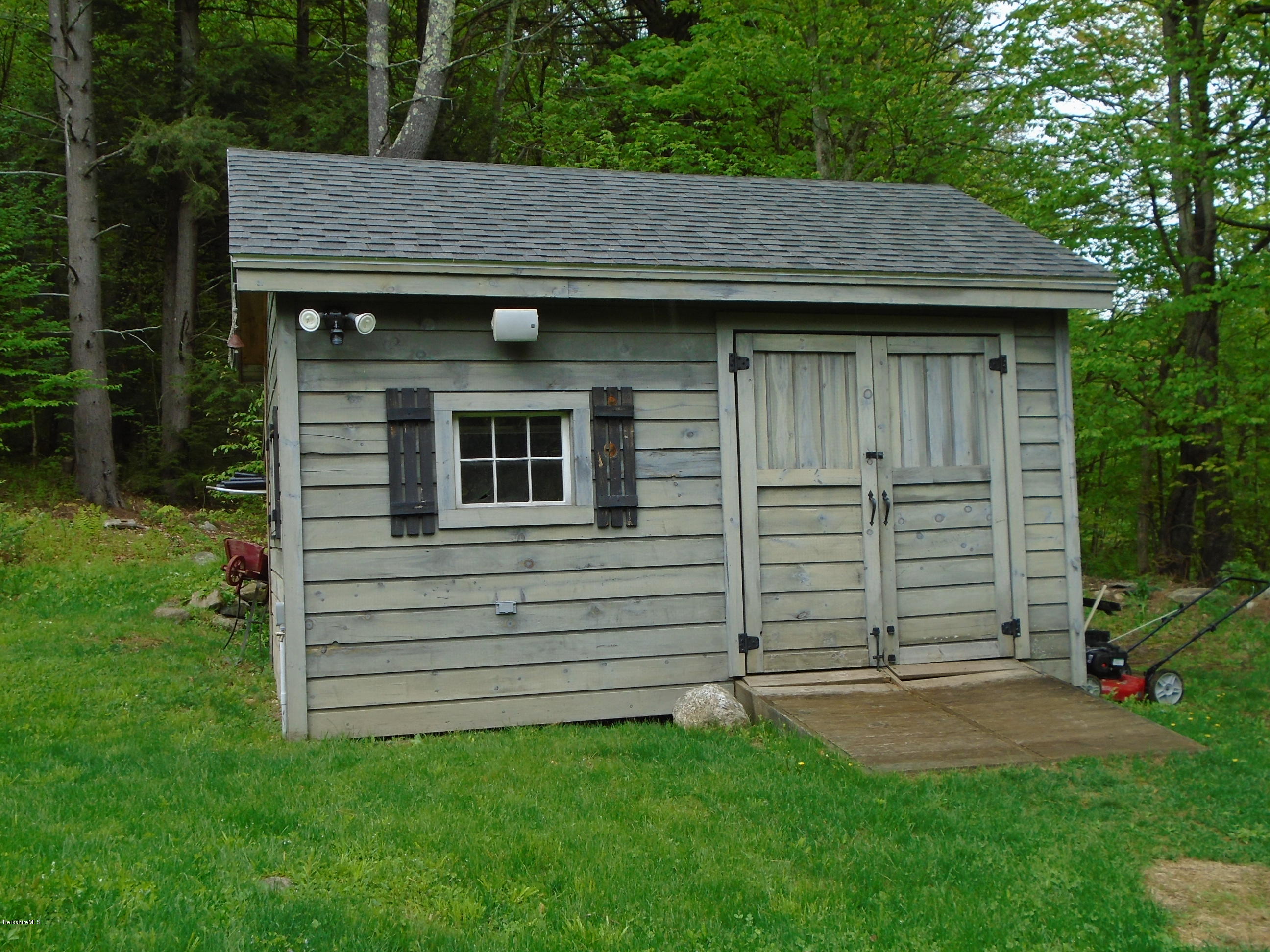 1350 South Main Road Otis, MA 01253 - Photo 48 of 56 a view of a backyard that has brick walls