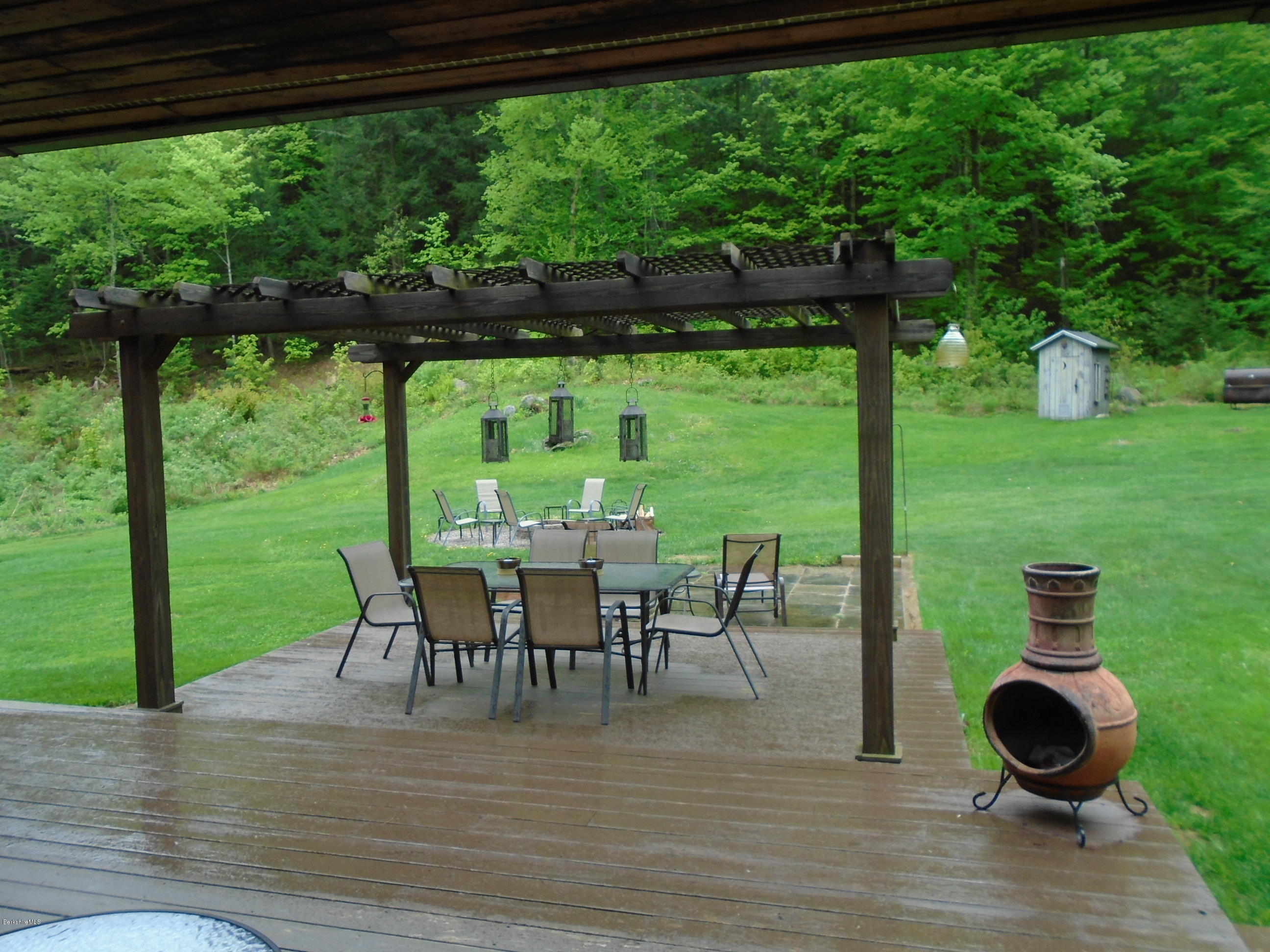 1350 South Main Road Otis, MA 01253 - Photo 55 of 56 a view of a porch with furniture and yard