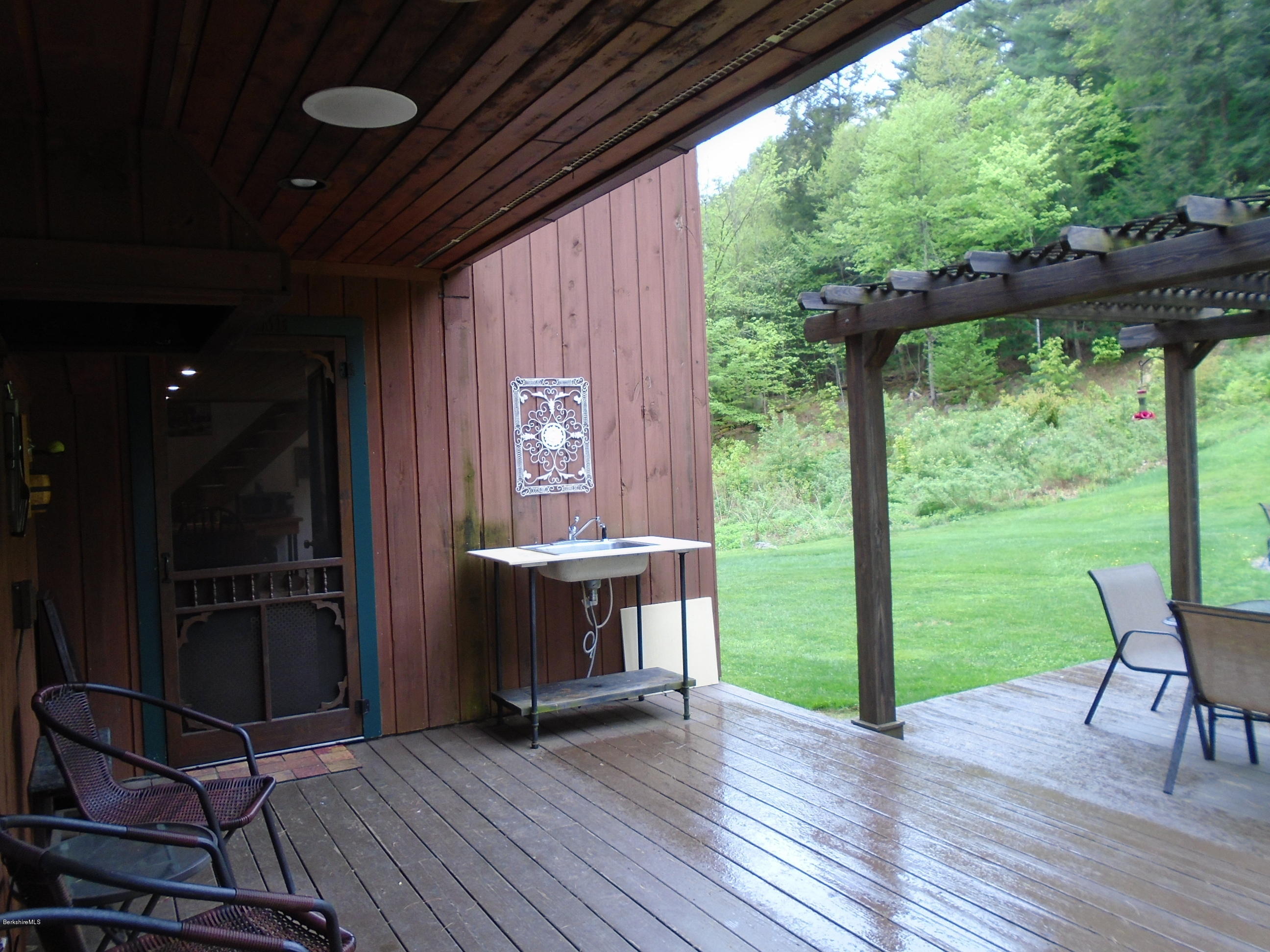 1350 South Main Road Otis, MA 01253 - Photo 56 of 56 a view of outdoor space with wooden floor and backyard