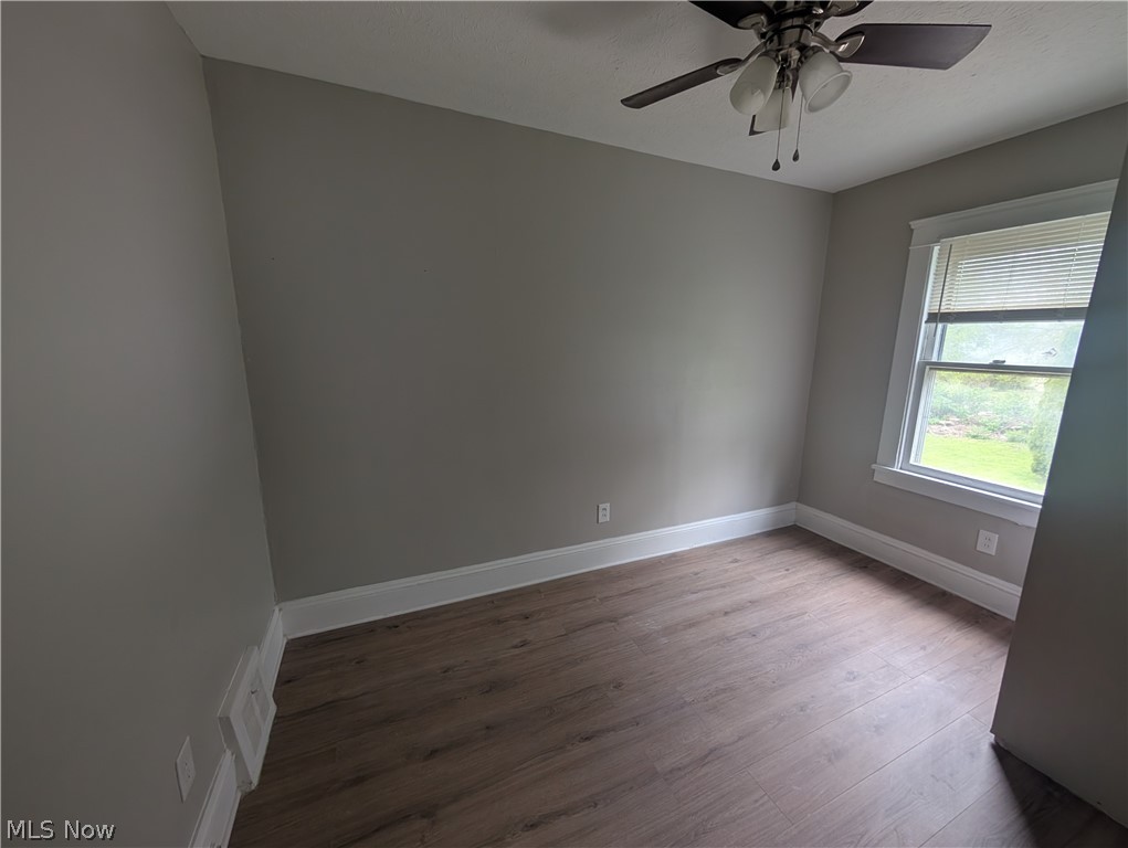 7515 Ottawa Road Cleveland, OH 44105 - Photo 16 of 21 Interior room with light gray walls and wood-finish flooring