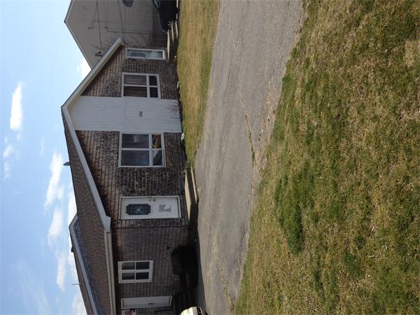 306 Baker Street Fall River, MA 02721 - Photo 1 of 1 a house with trees in front of it