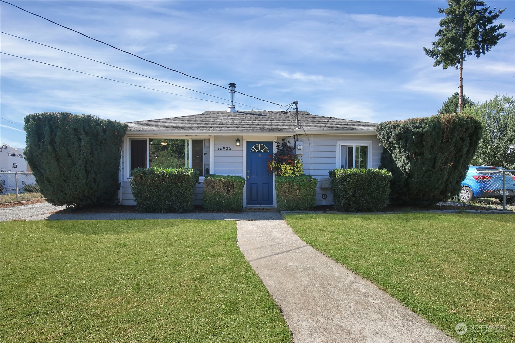 a front view of a house with garden