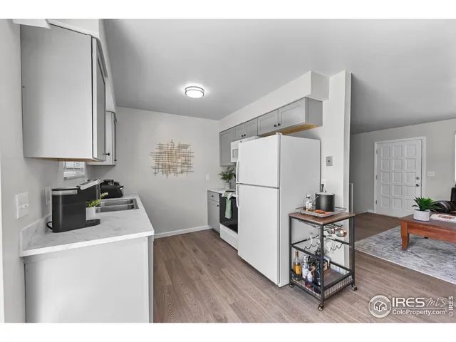 a bathroom with a shower curtain and a sink