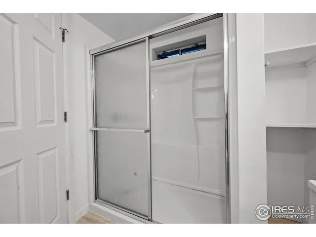 a view of a patio with a table and chairs