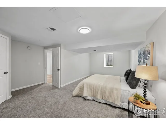 a view of a patio with a table and chairs