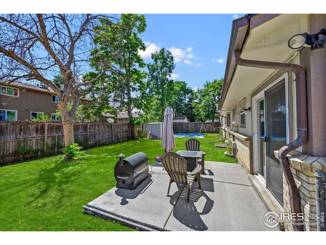 a bathroom with a toilet a sink a mirror and a shower