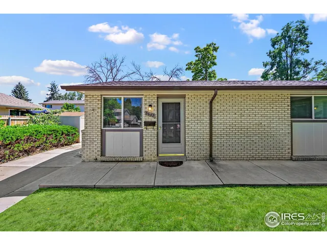 a view of a dining room with furniture and a potted plant