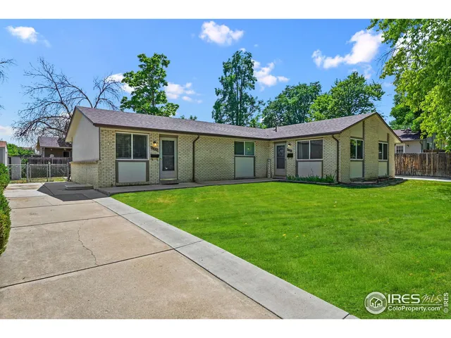 a view of a patio with table and chairs and potted plants