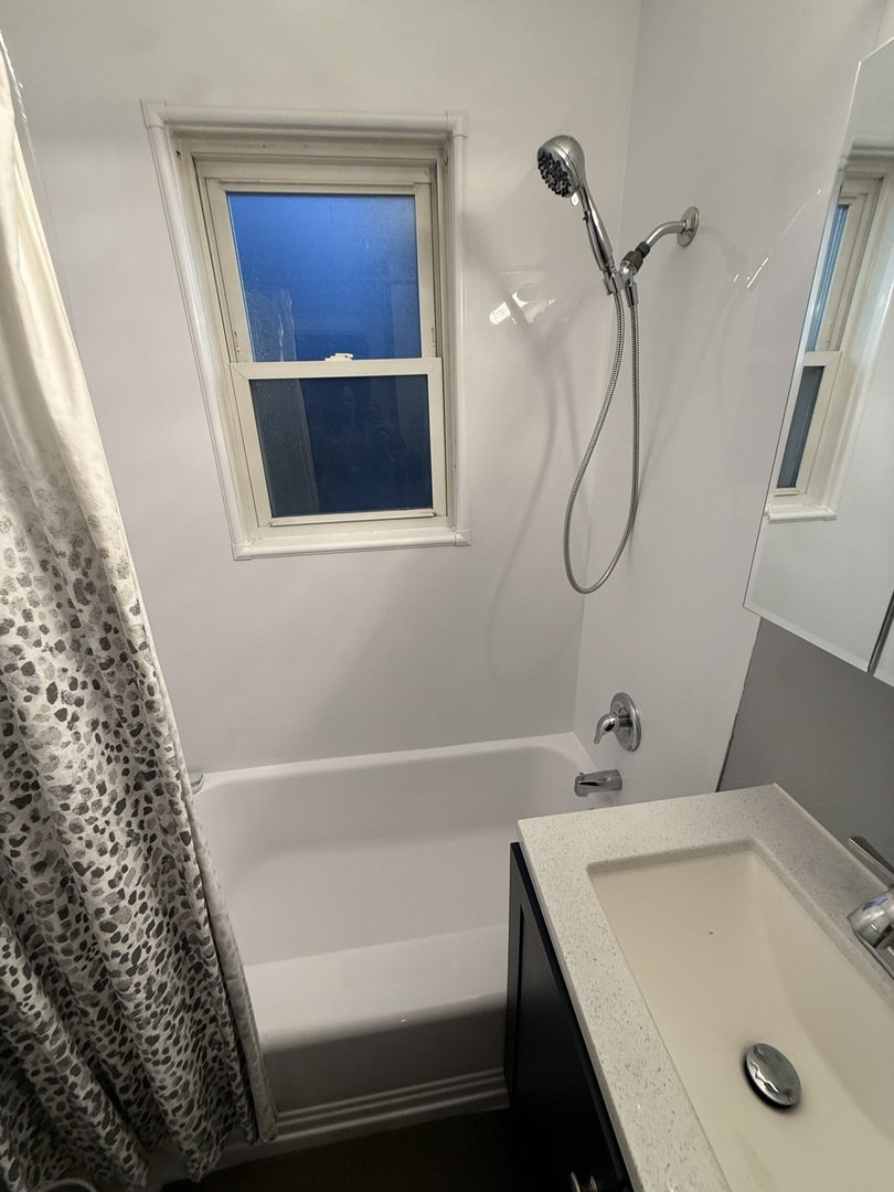 2610 West 80th Street Chicago, IL 60652 - Photo 16 of 27 a bathroom with a sink and a shower