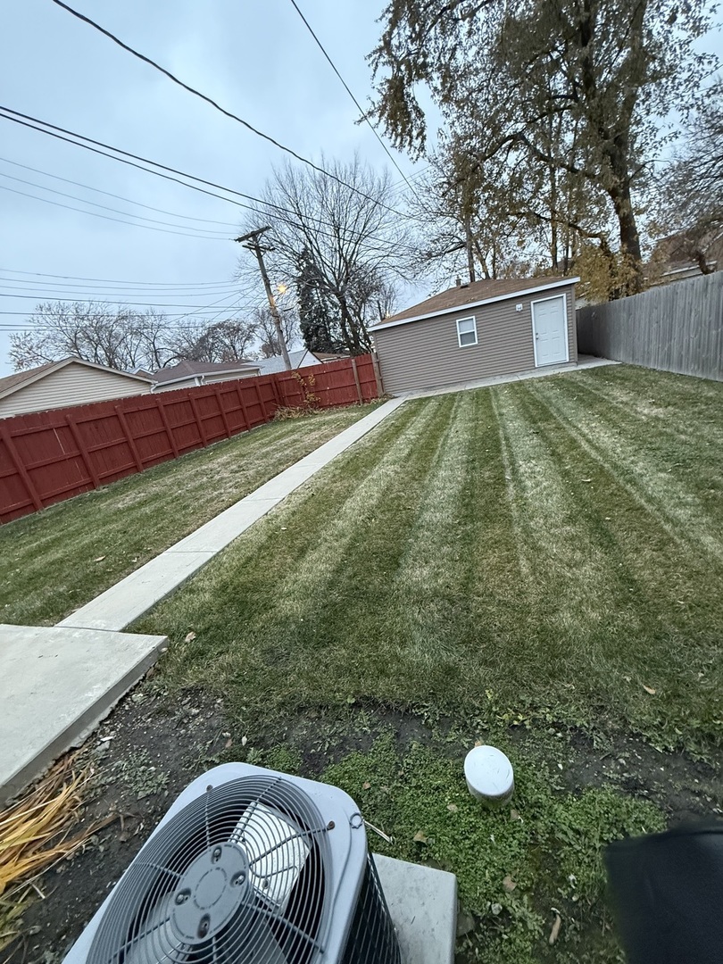 2610 West 80th Street Chicago, IL 60652 - Photo 22 of 27 a view of a white house with a yard