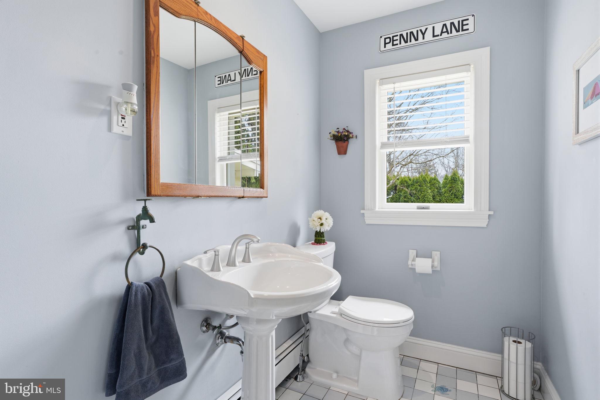 211 Longview Avenue Langhorne, PA 19047 - Photo 12 of 62 a bathroom with a toilet sink and mirror